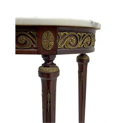 Pair of late 20th century French design mahogany console tables, D-end form with white and grey veined marble tops, the frieze rails decorated with scrolled leaf and flower head cast brass mounts, on turned and fluted supports with cast brass mounts and feet 