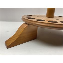 Pine stick stand, with turned central column dividing two circular tiers, upon three feet, with capacity for twenty four walking sticks, H73cm