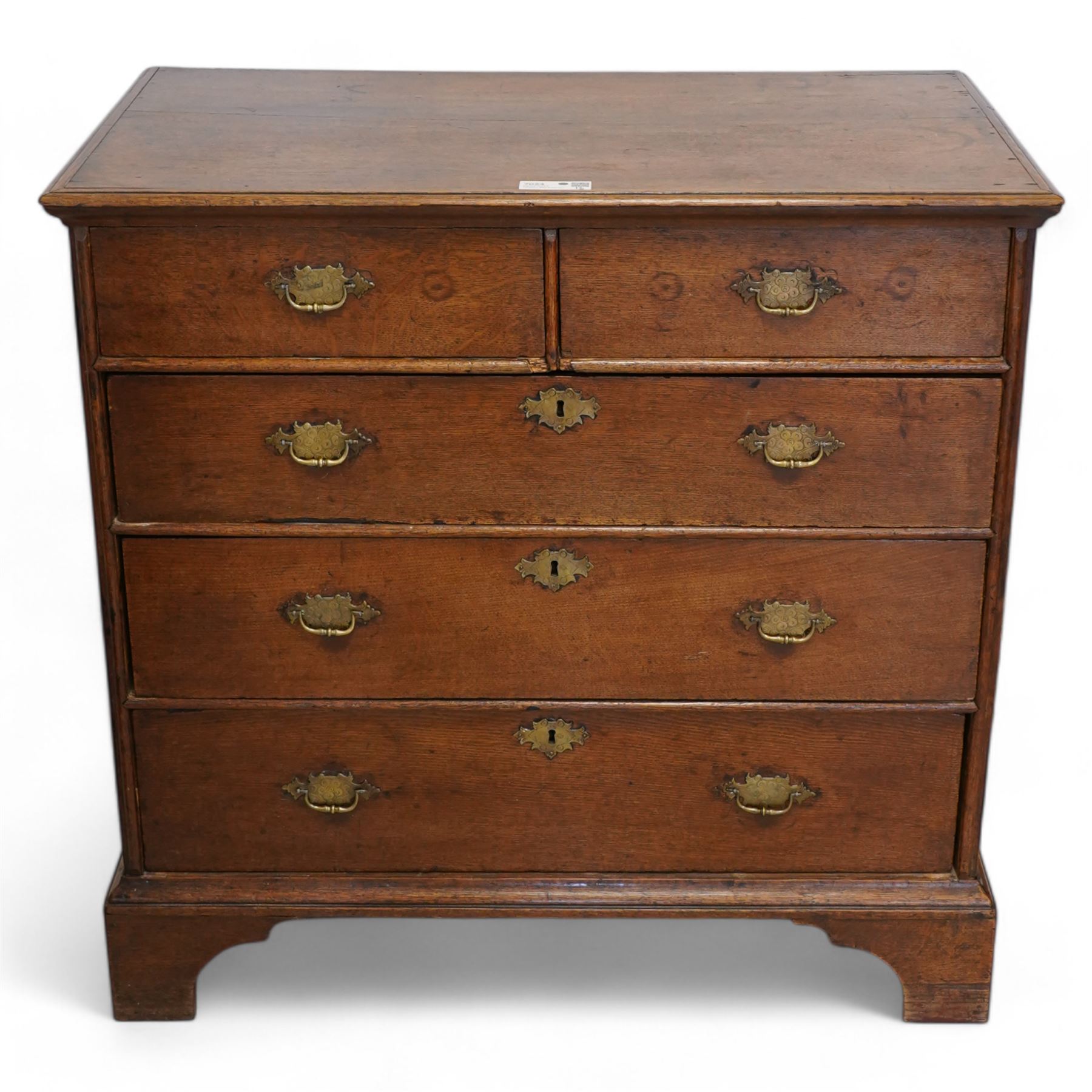 George III oak chest, moulded rectangular top over two short and three long drawers, shaped handles plates with engraved decoration, on bracket feet