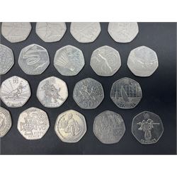 Forty Queen Elizabeth II commemorative fifty pence coins from circulation