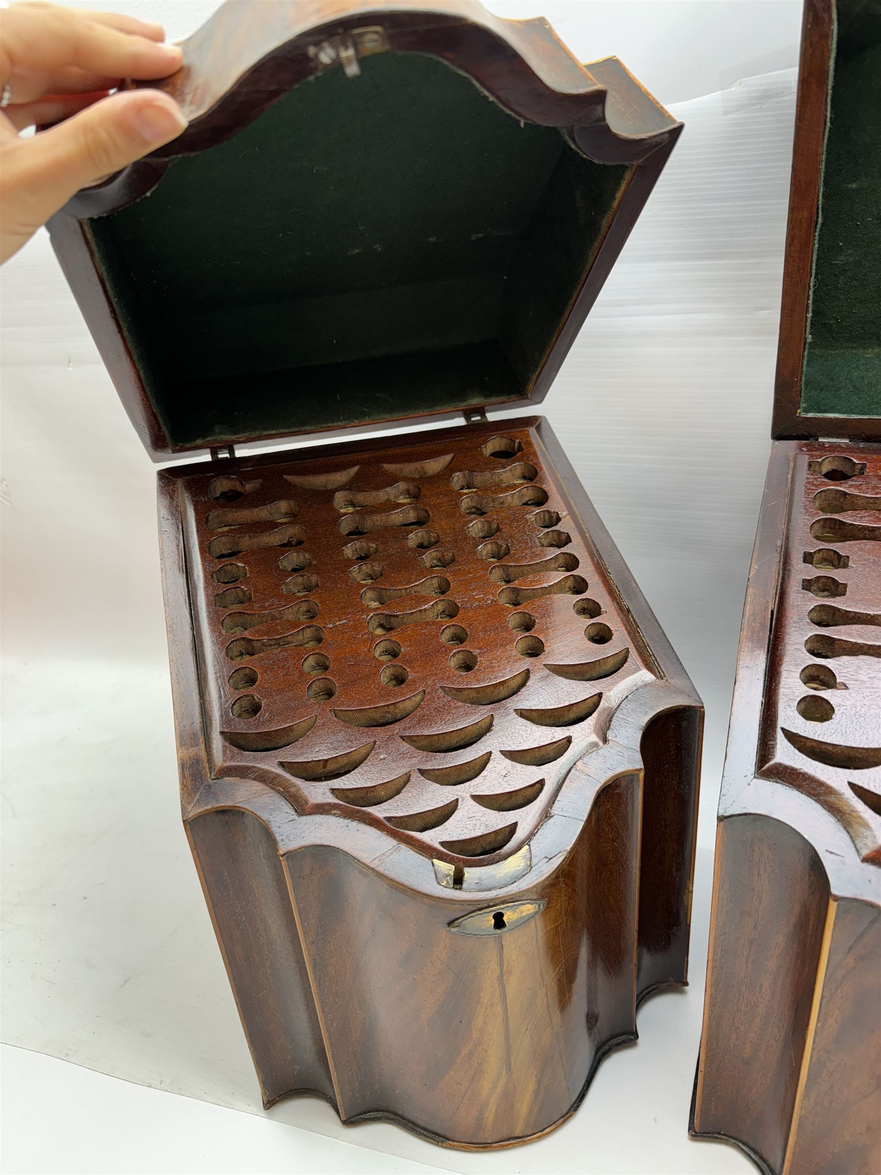 Pair of George III mahogany knife boxes, each of serpentine fronted form with strung detail to the hinged cover and body, opening to reveal a fitted interior, H38cm