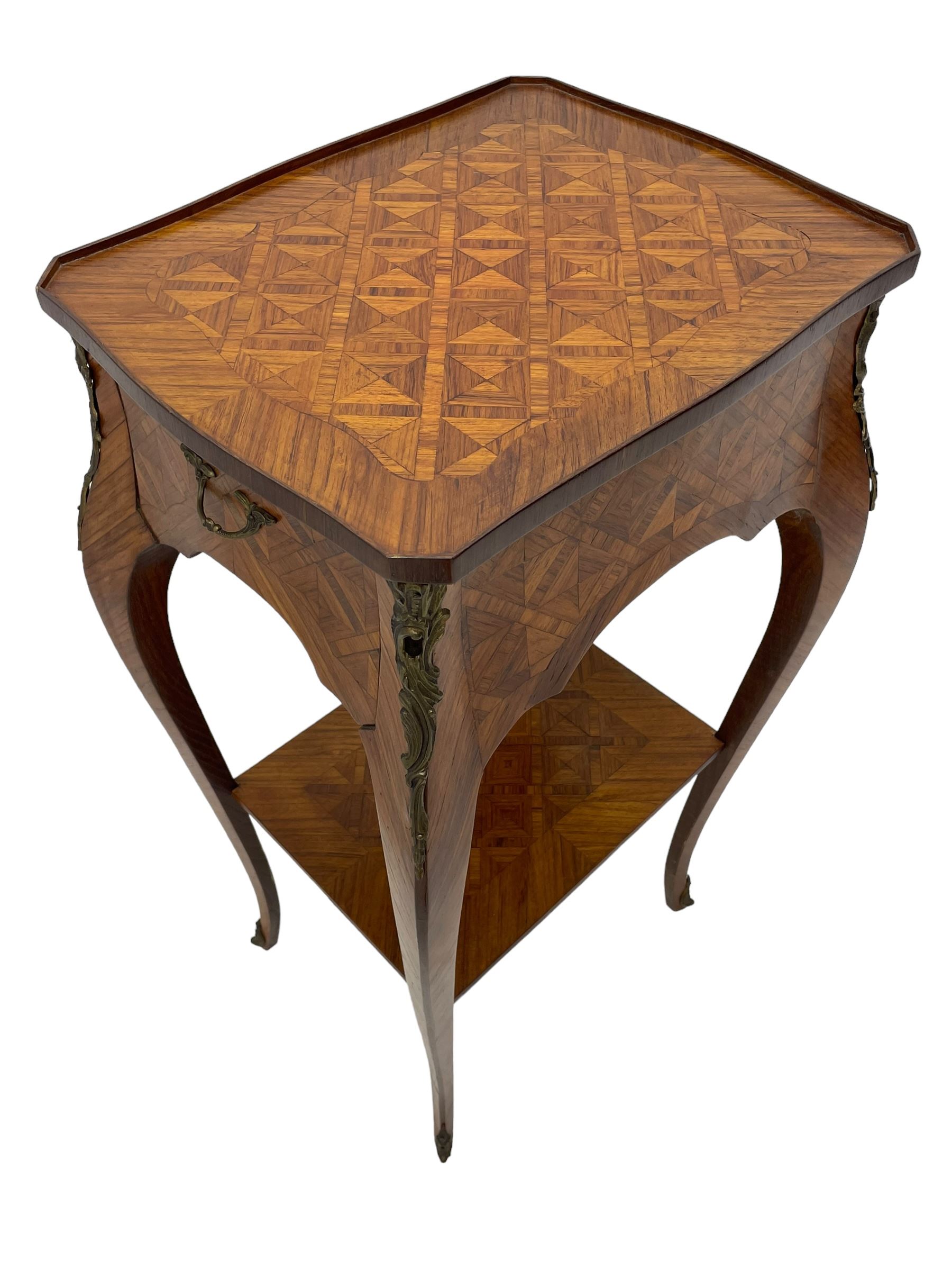 Late 20th century French design Kingwood lamp table, shaped form with geometric parquetry inlaid top within band and raised lip, fitted with single drawer and slide, on cabriole supports united by undertier, decorated with ornate cast gilt metal mounts and terminal caps 