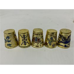 Ten cloisonne thimbles, decorated with, flowers, birds, dragons, butterflies, and other animals