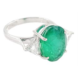 18ct white gold three stone oval cut emerald and trillion cut diamond ring, stamped, emerald approx 5.65 carat, total diamond weight approx 0.65 carat