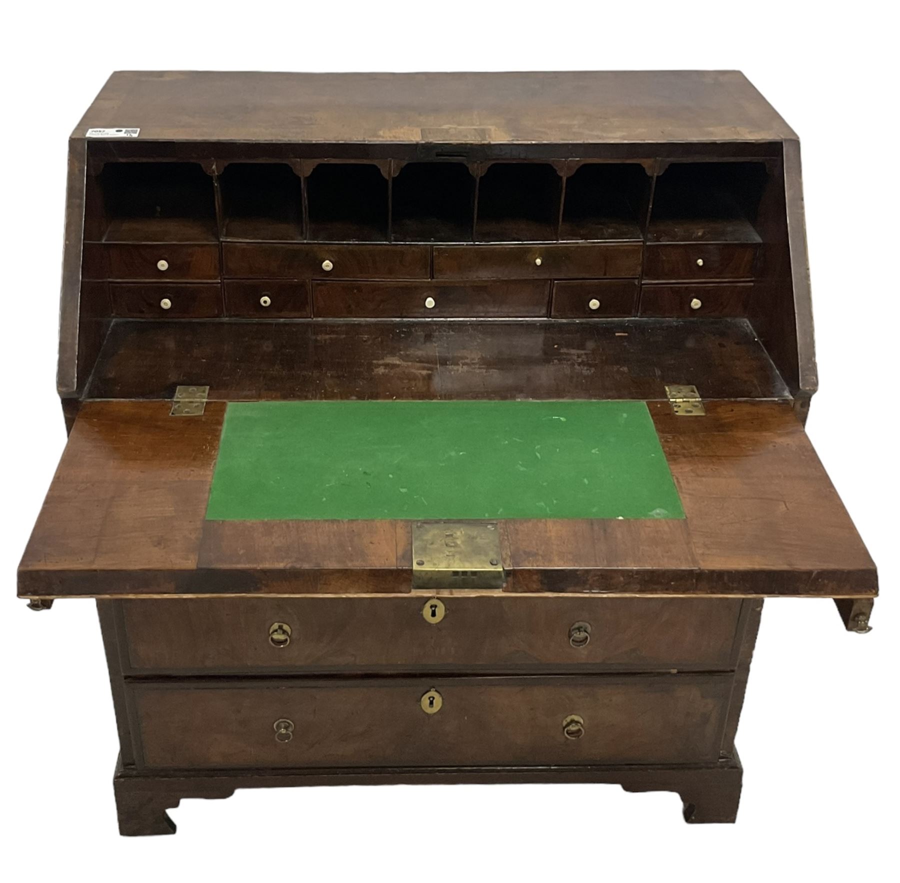 18th century walnut bureau, crossbanded and feather-banded rectangular top and fall-front, enclosing fitted interior with pigeonholes and correspondence drawers with bone handles, over two short and three long graduating drawers with moulded facias and original brass handles, on bracket feet