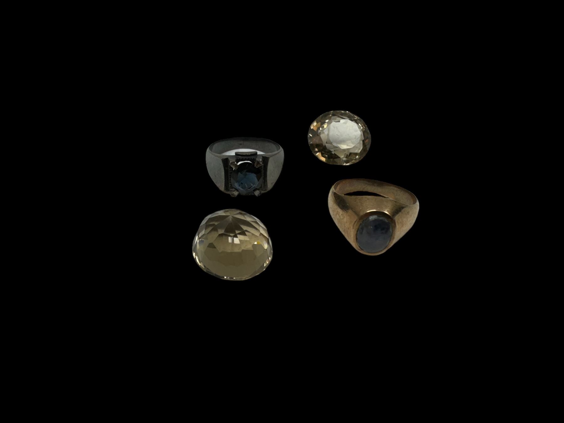 8ct gold single stone star sapphire ring, silver stone set ring and two loose smokey quartz stones