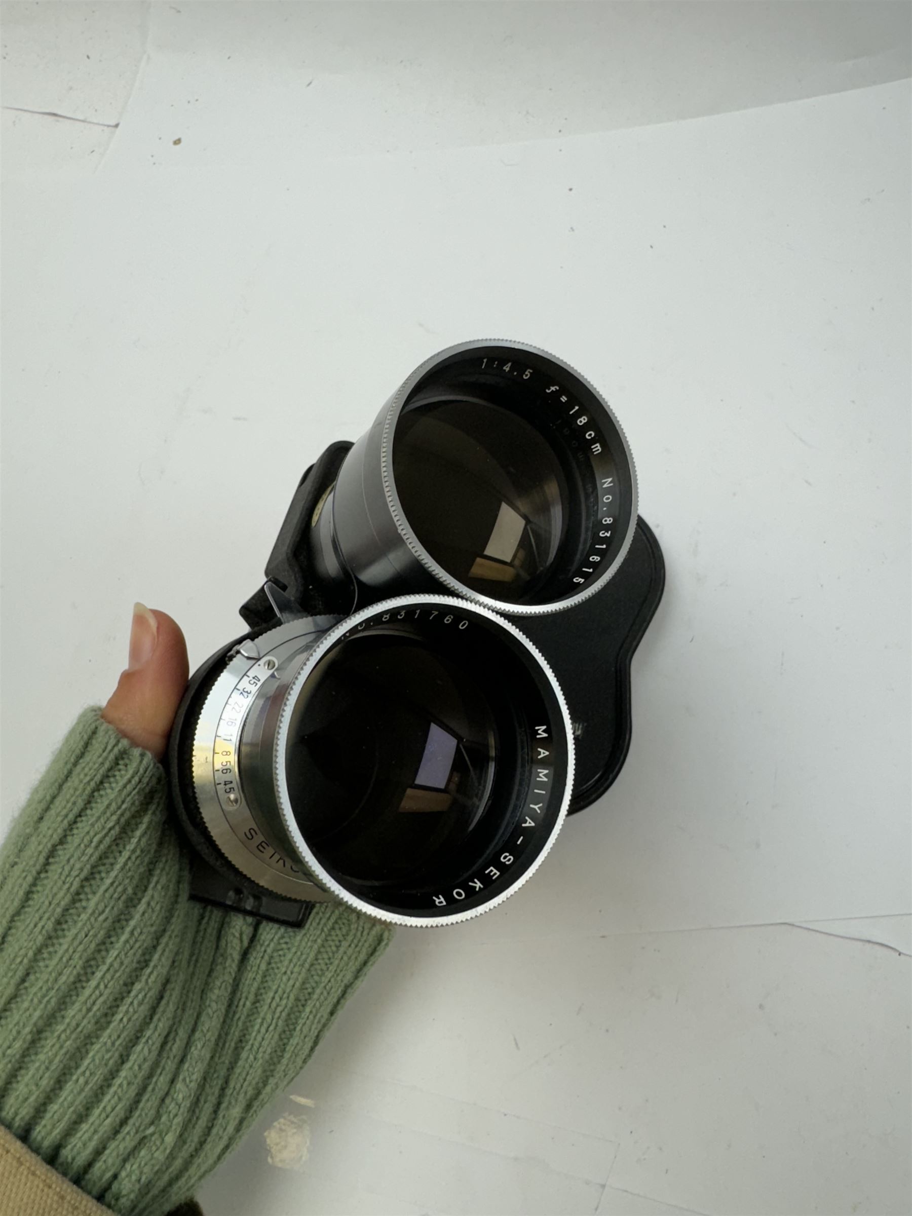 Two Mamiya Sekor twin lens reflex TLR camera lenses, comprising Seikosha-S 1:4.5 f=18cm serial nos. 831615 & 831760, and 1:3.5 f=65mm serial no. 574050, together with a Mamiya/Sekor view finder and lens caps