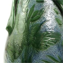 C.H. Brannam Barnstaple art pottery vase, baluster form, with three twisted scroll handles, incised with birds amongst flowers in blue green glaze, incised marks, dated 1905, H53cm