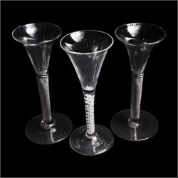 Pair of Georgian multi spiral air twist wine glasses, and an opaque twist wine glass, with bell shaped bowls and raised on conical feet, H18cm (3)