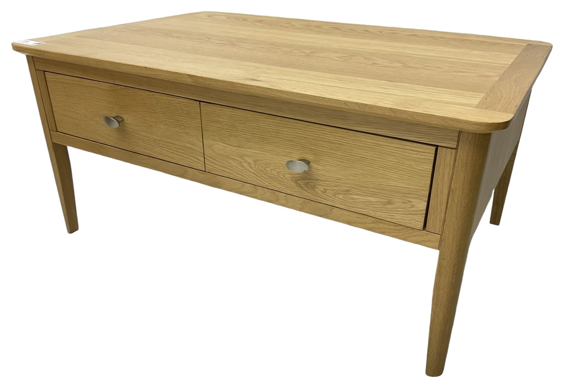 Contemporary light oak rectangular coffee table, fitted with single drawer disguised as two drawers to each side, on tapering supports