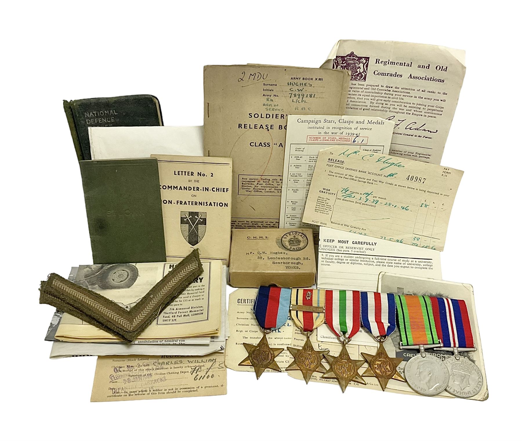 WWII group of six medals comprising 1939-45 Star, The Africa Star, The Italy Star, France and Germany Star, Defence Medal and War Medal 1939-45, awarded to 7899181 RAC C.W Hughes, together with two chevrons and ephemera relating to Charles William 'Bill' Hughes including Soldier's Release Book, photographs, certificates of transfers etc 