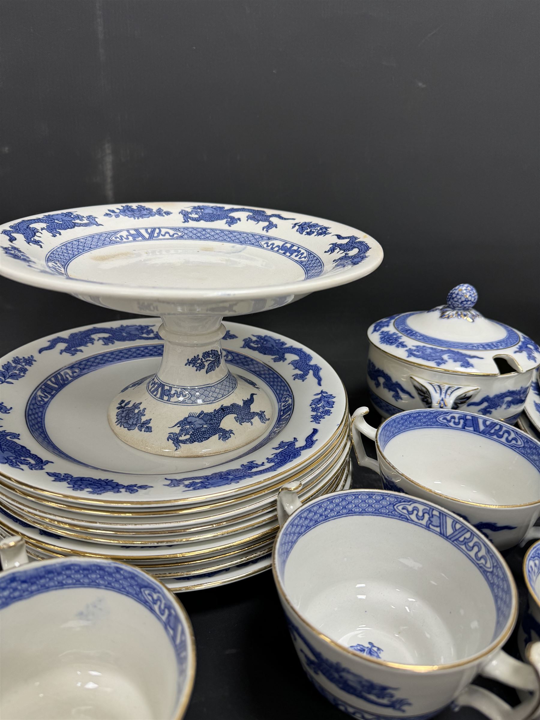 Extensive tea and dinner service of Booths and Cauldon dragon pattern, including, teapots, coffee pots, jugs, toast racks, bowls, dinner plates, platters, soup tureen etc 