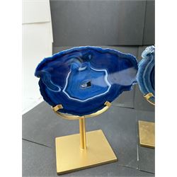 Pair of blue agate slices, polished with rough edges, raised upon gilt metal stands, H20cm