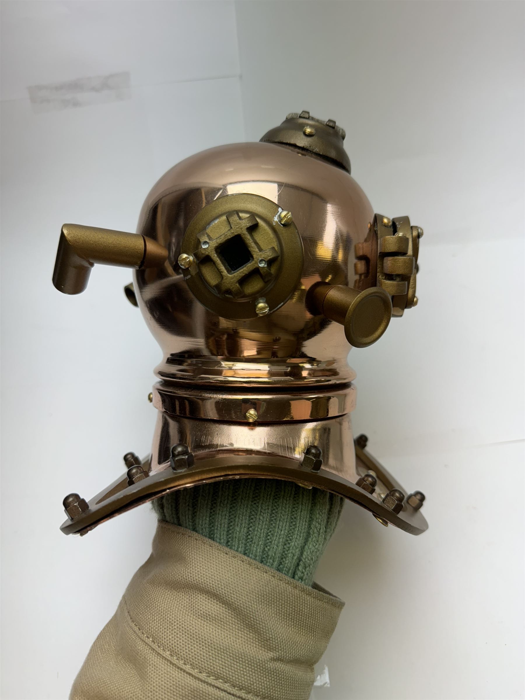 Copper novelty miniature diving helmet, together with underwater camera, helmet H20cm