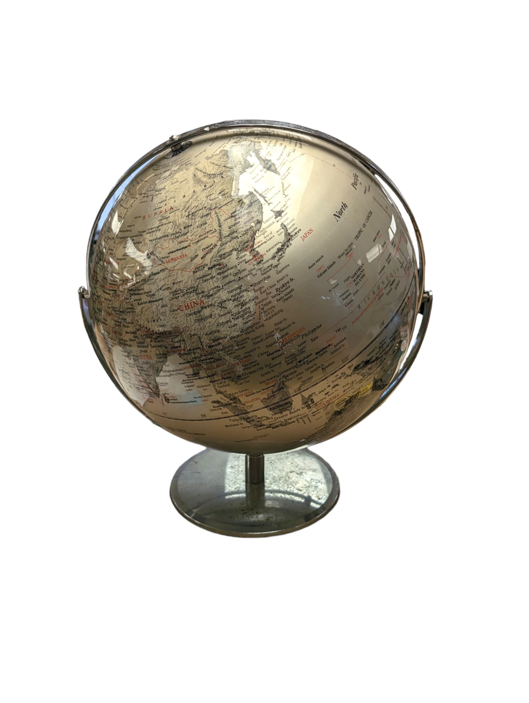 World globe, with red and black writing on a silvered ground, H50cm