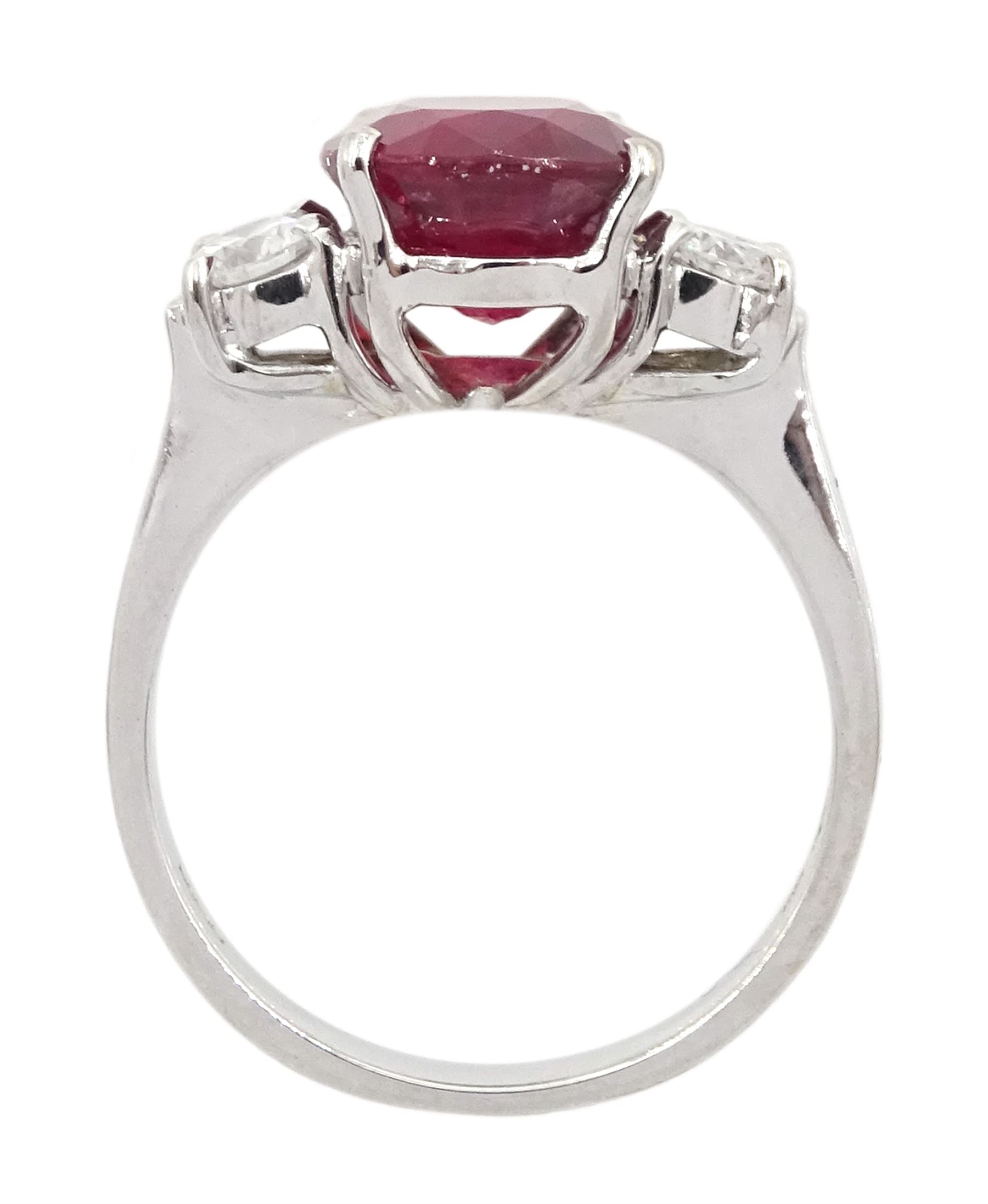 18ct white gold three stone oval cut ruby and round brilliant cut diamond ring, hallmarked, ruby approx 4.30 carat