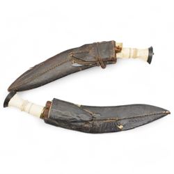 Nepalese Kukri with engraved blade and two skinning knives with bone handles in leather sc...