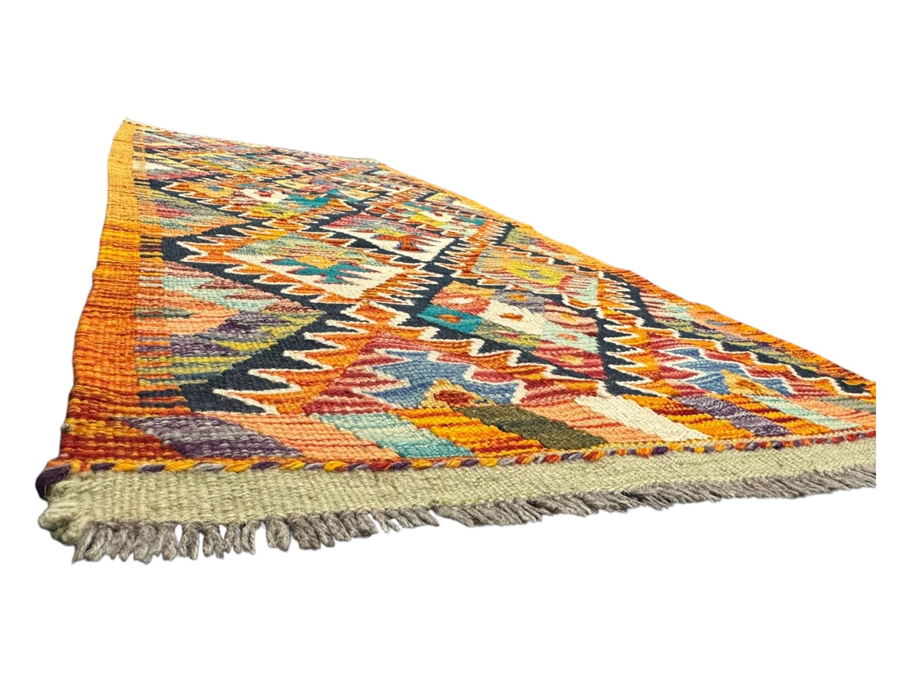 Chobi Kilim multicoloured ground runner, displaying diamond-shaped motifs in shades of blue, red, yellow, and green, accented by a bold black outline and bordered with a striped design, flatwoven with fringed edges