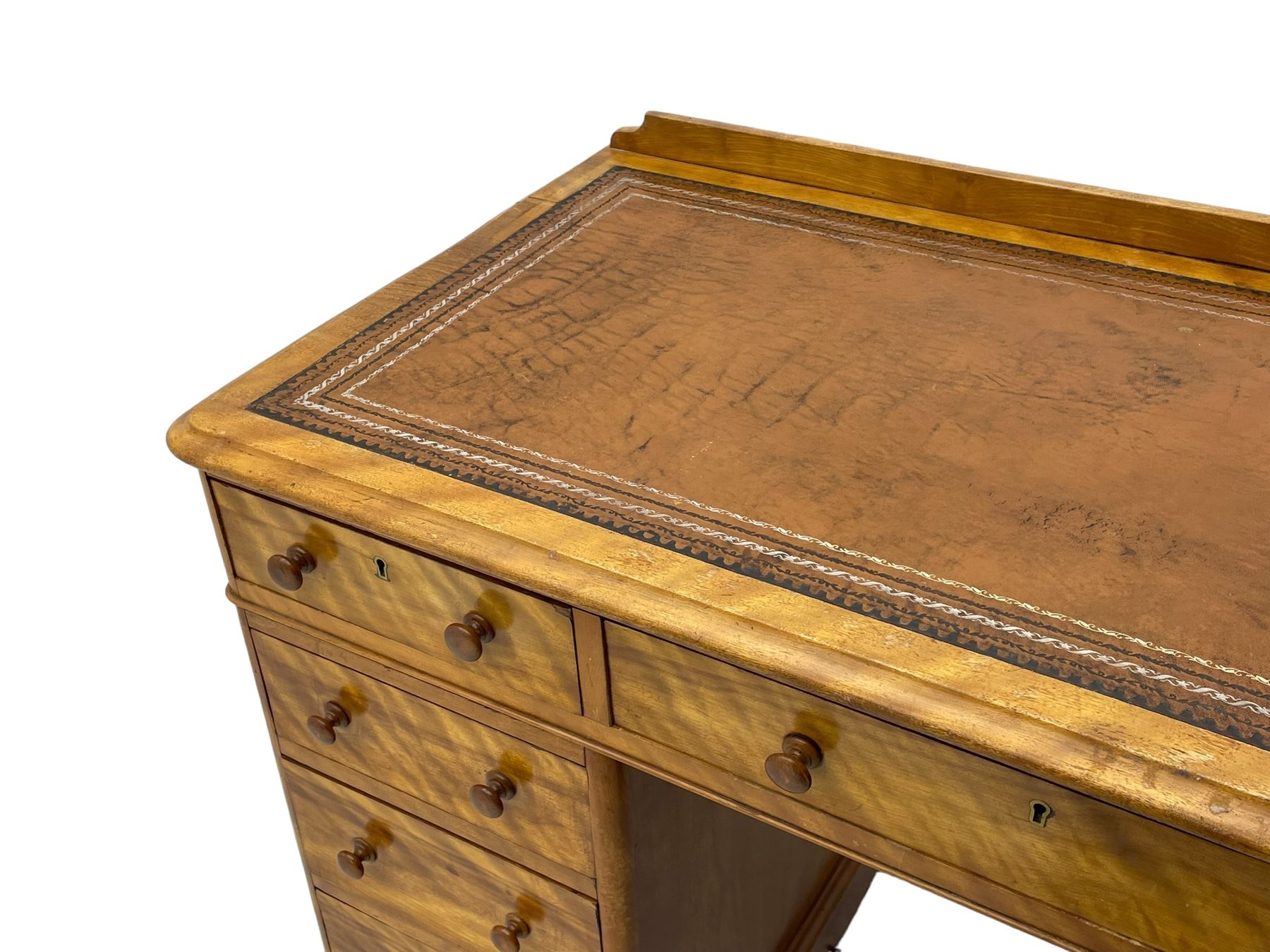 Victorian satin walnut twin pedestal desk, moulded rectangular top with rounded corners and raised back, inset leather writing surface with tooled borders, fitted with nine drawers with turned handles, on moulded plinth base 