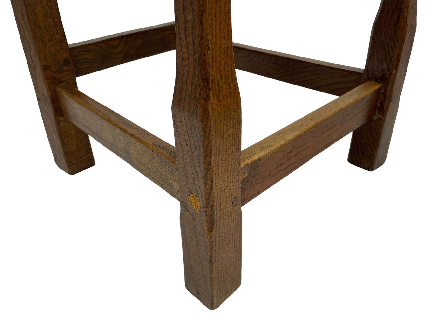 Gnomeman - set of eight (6+2) oak dining chairs, adzed panelled back over tan leather upholstered seat with applied stud band, on square supports united by plain stretchers, each chair carved with gnome signature, by Thomas Whittaker, Littlebeck, Whitby