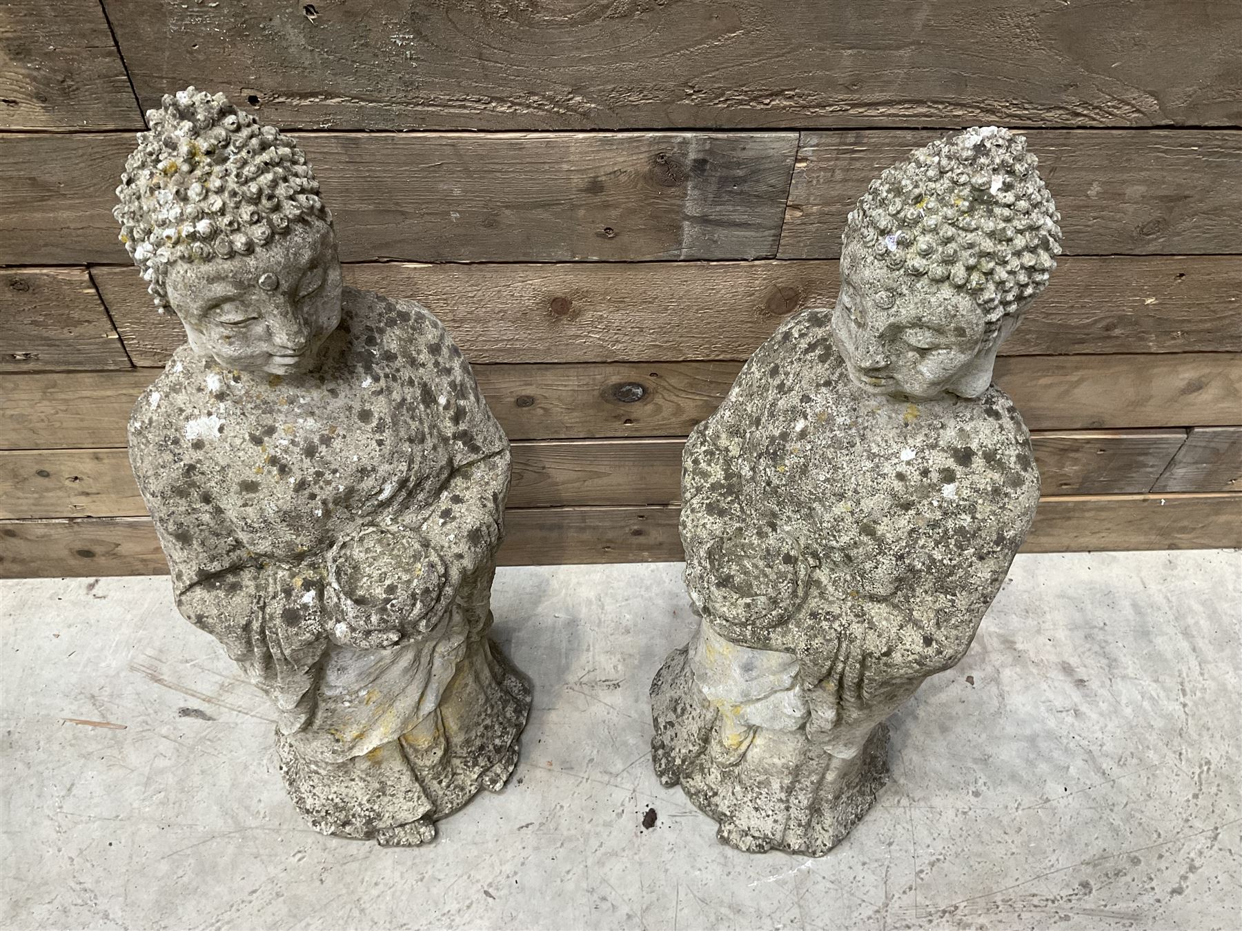 Pair of cast stone garden Buddahs