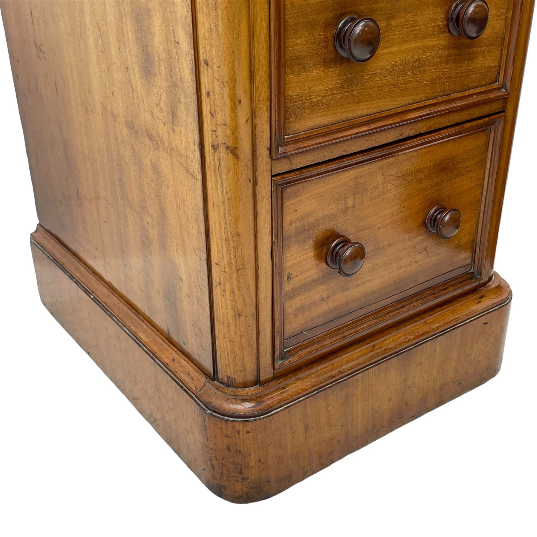 Pair of Victorian figured mahogany pedestal chests, rectangular form with rounded front corners, moulded top over three drawers with applied mouldings and turned handles, on moulded plinth base