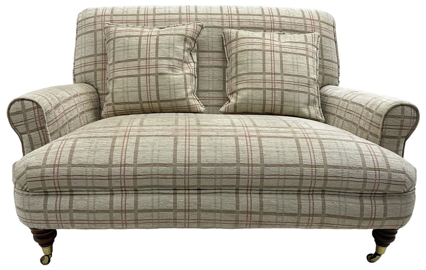 Traditionally shaped two-seat sofa, rolled back and arms, upholstered in checkered fabric, on turned front supports with brass cups and castors 