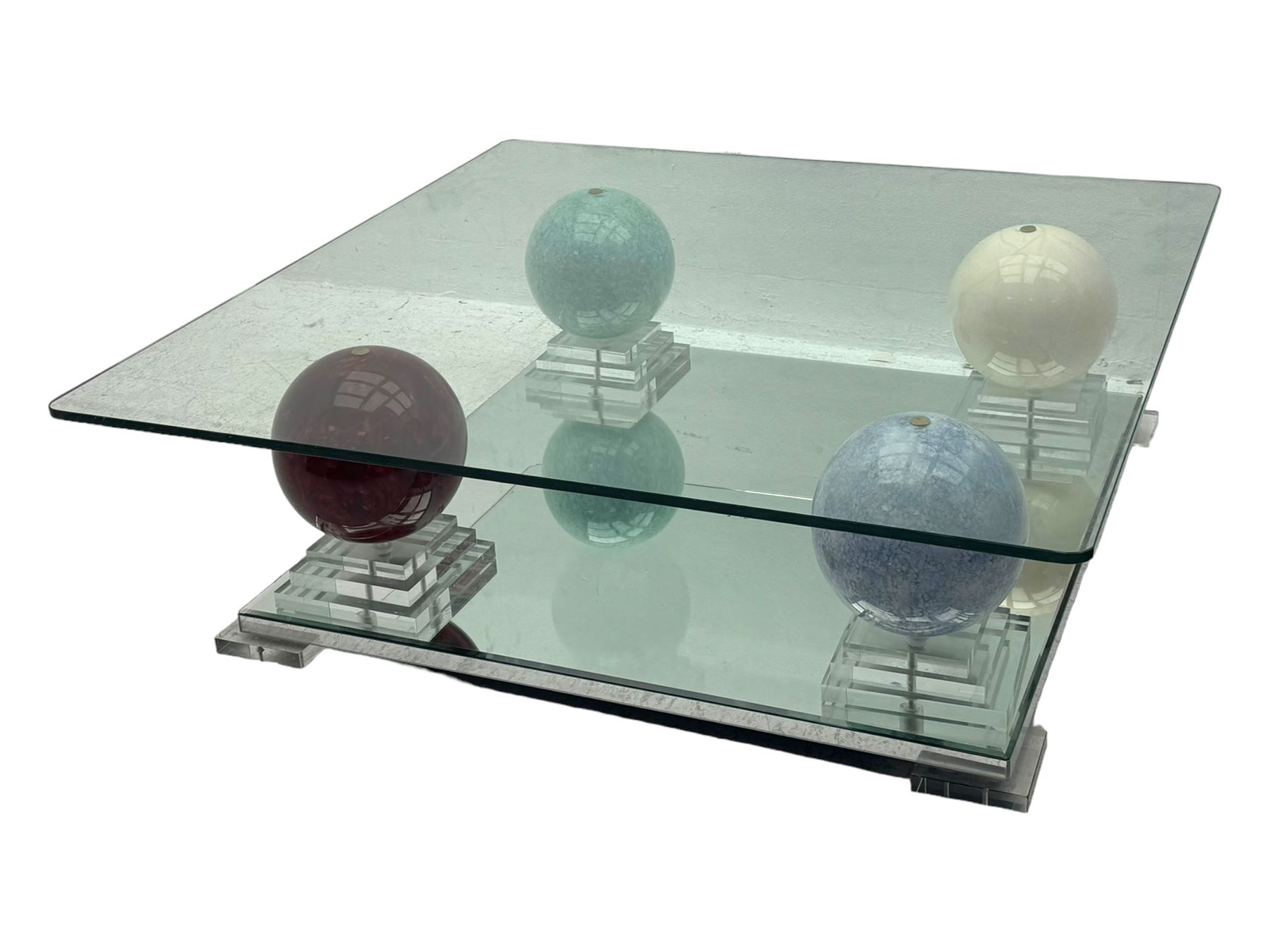 Barker & Stonehouse - contemporary glass coffee table, square top supported by four multicoloured marble spheres, each elevated on layered acrylic pedestal over mirrored base, on square clear supports