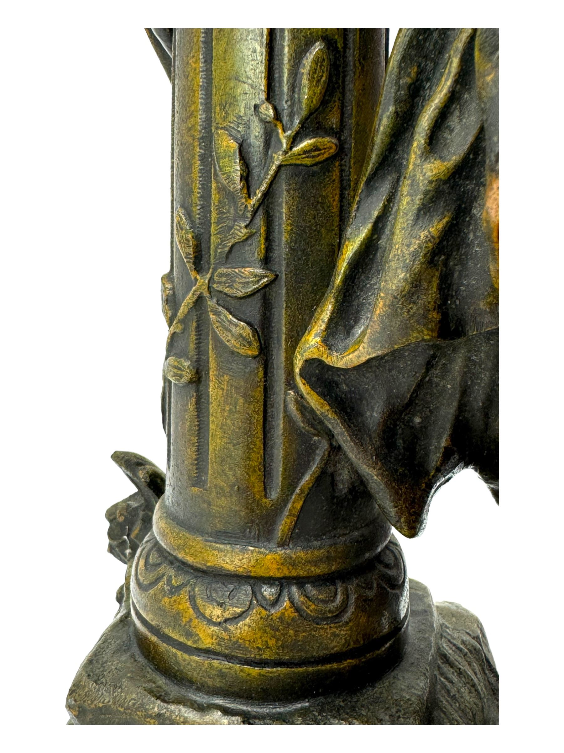 After L & F Moreau - Spelter table lamp in the form of a female figure next to a pedestal on circular naturalistic base H55cm