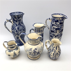  Yorkshire Moorlands, Tranquiline and other pottery blue and white spongeware jugs, H41cm max (6)  
