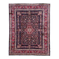 Persian Hamadan indigo ground carpet, the field decorated with central rectangle and outer...