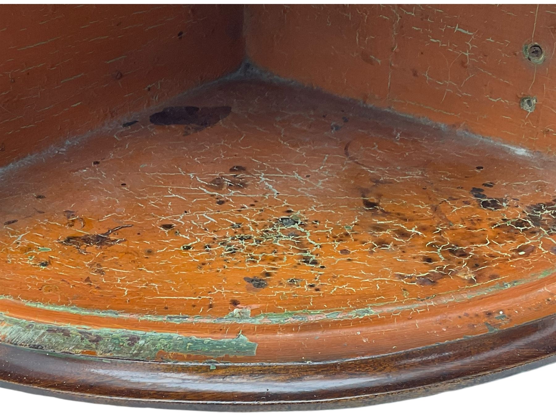 George III mahogany bow-front corner cupboard, enclosed by two figured doors with brass hinges and escutcheon, the painted interior fitted with three shelves 