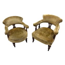 Victorian pair of mahogany armchairs, upholstered in gold velvet fabric, each with curved back, pierced splat and scroll arms, one with rounded seat and the other square, on turned front supports with castors