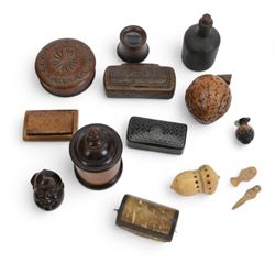 Collection of snuff boxes including a craved wooden example, black papier-mâché example, t...