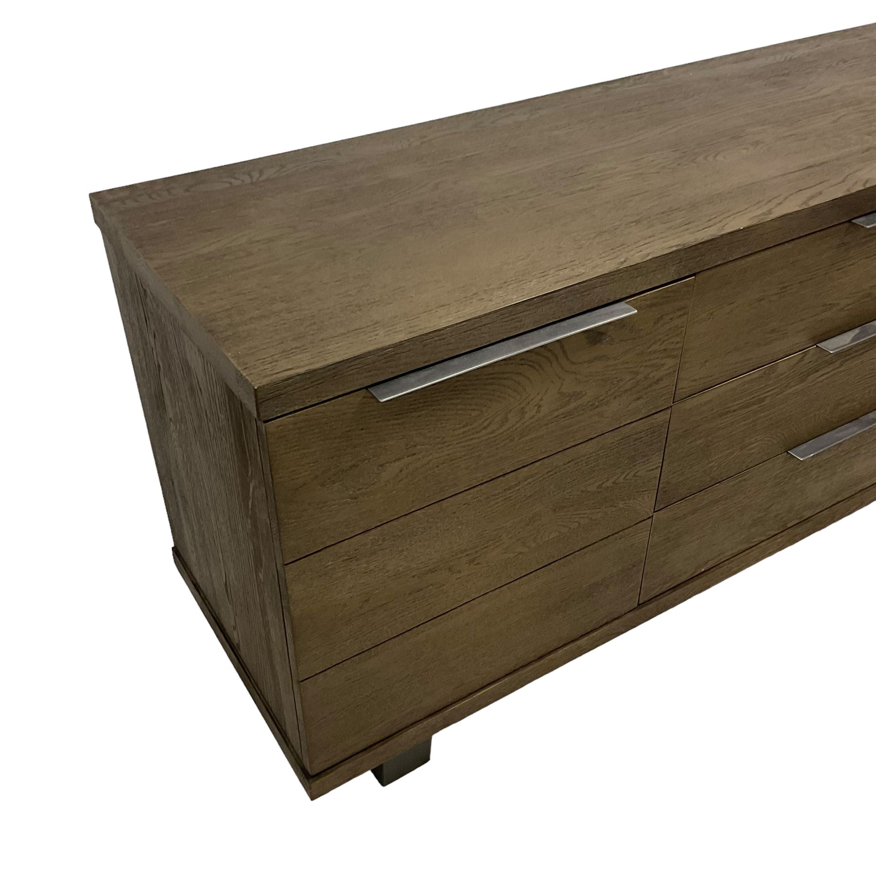 Contemporary dark oak finish sideboard, three central drawers flanked by single cupboards, on angular black finish metal supports 