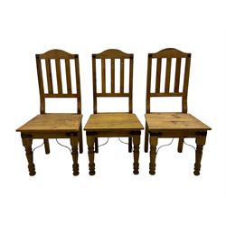 Set of six waxed pine dining chairs, shaped cresting over vertical slat back, plank seat on turned front supports 