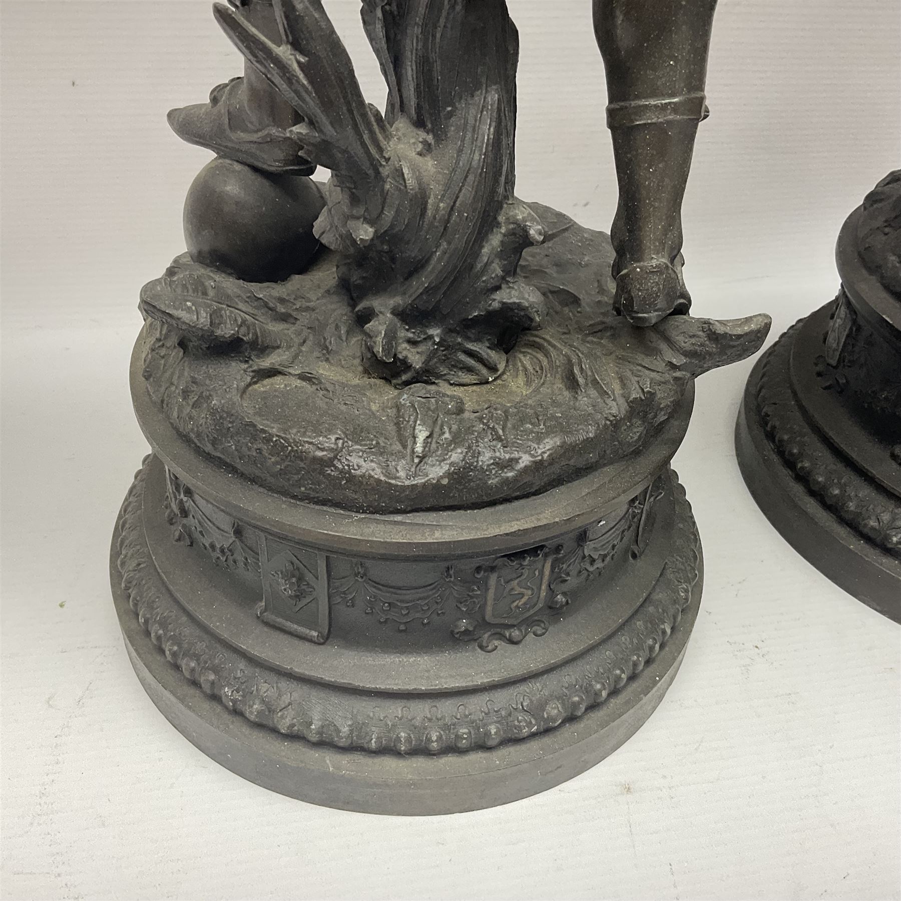 Pair spelter warriors, both with shields with a naturalistic ground and a plinth with relief decoration, H51cm