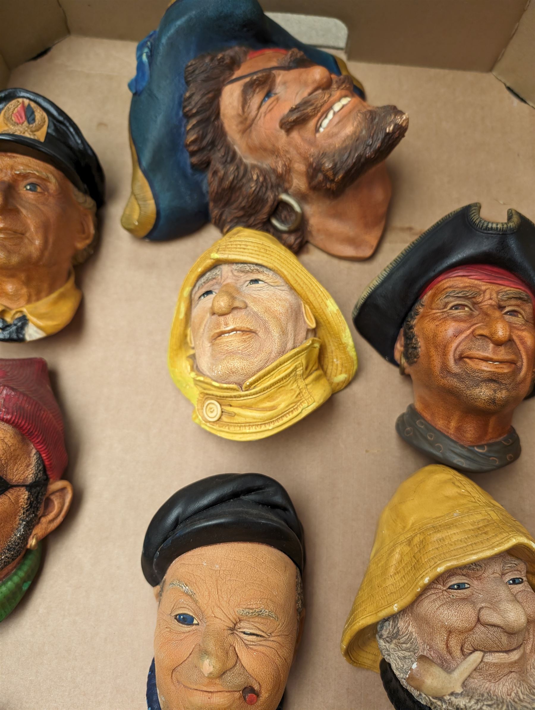 Ten Bossons Chalkware masks, all maritime themed, to include fishermen, pirates, etc 