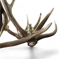 Deer antler chandelier, of triangular form, with three fitted lights H62cm