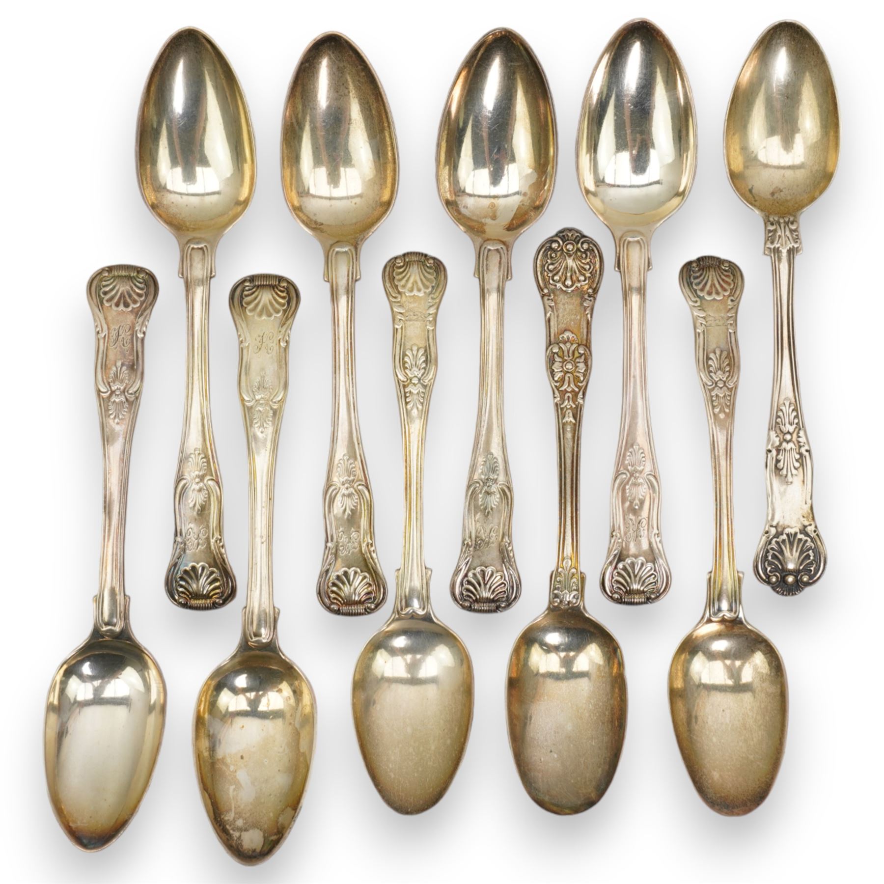 A matched set of 19th century silver Kings pattern cutlery comprising six table spoons, ten table forks, twelve dessert spoons, fish slice, pair of sauce ladles, ten teaspoons, six fish knives, seven silver handled knives, two salt spoons  and fifteen dessert forks, various dates and makers 