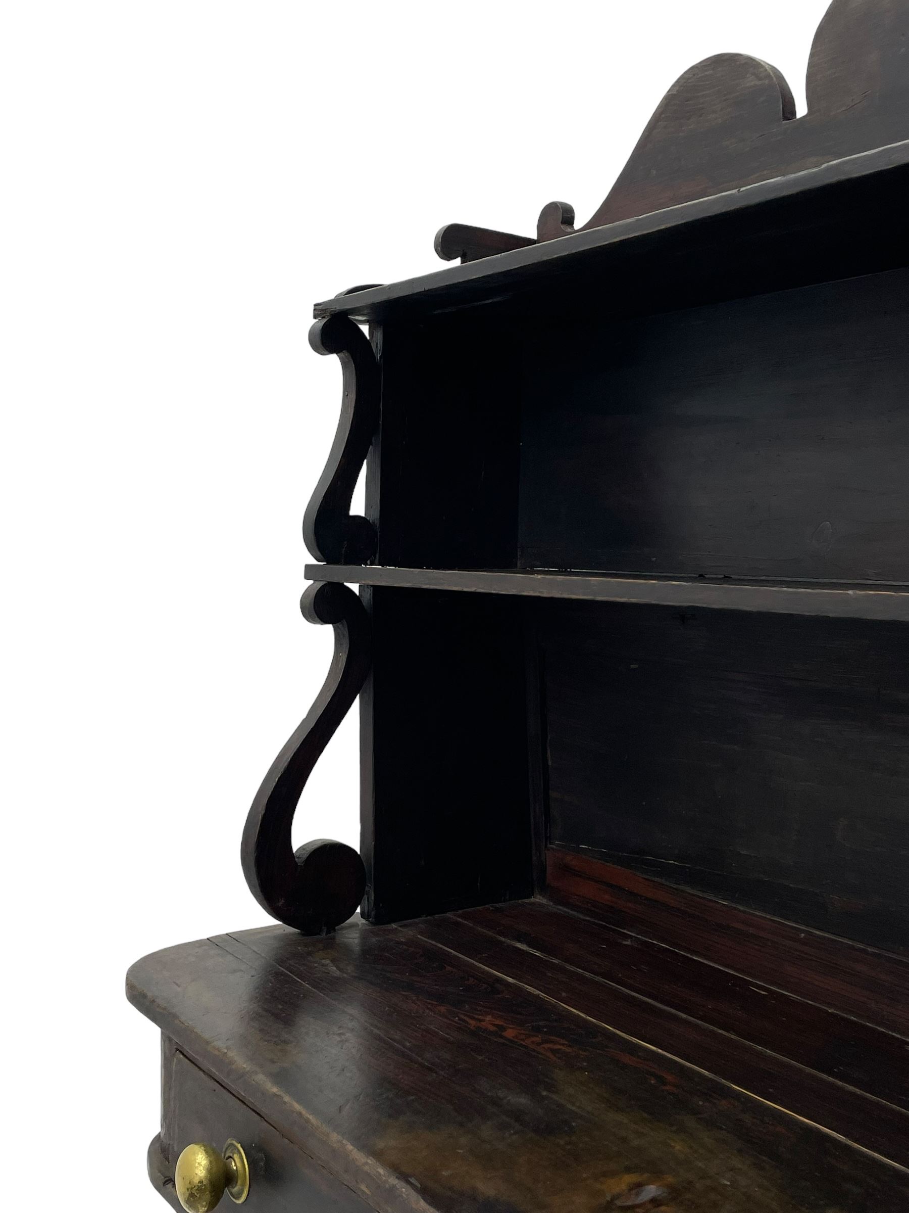 Victorian scumbled pine chiffonier, raised shaped back fitted with two shelves on S-scroll supports, rectangular top with rounded corners over single frieze drawer and open shelf, on projecting rounded sledge platforms and compressed bun feet, scumbled to resemble rosewood 