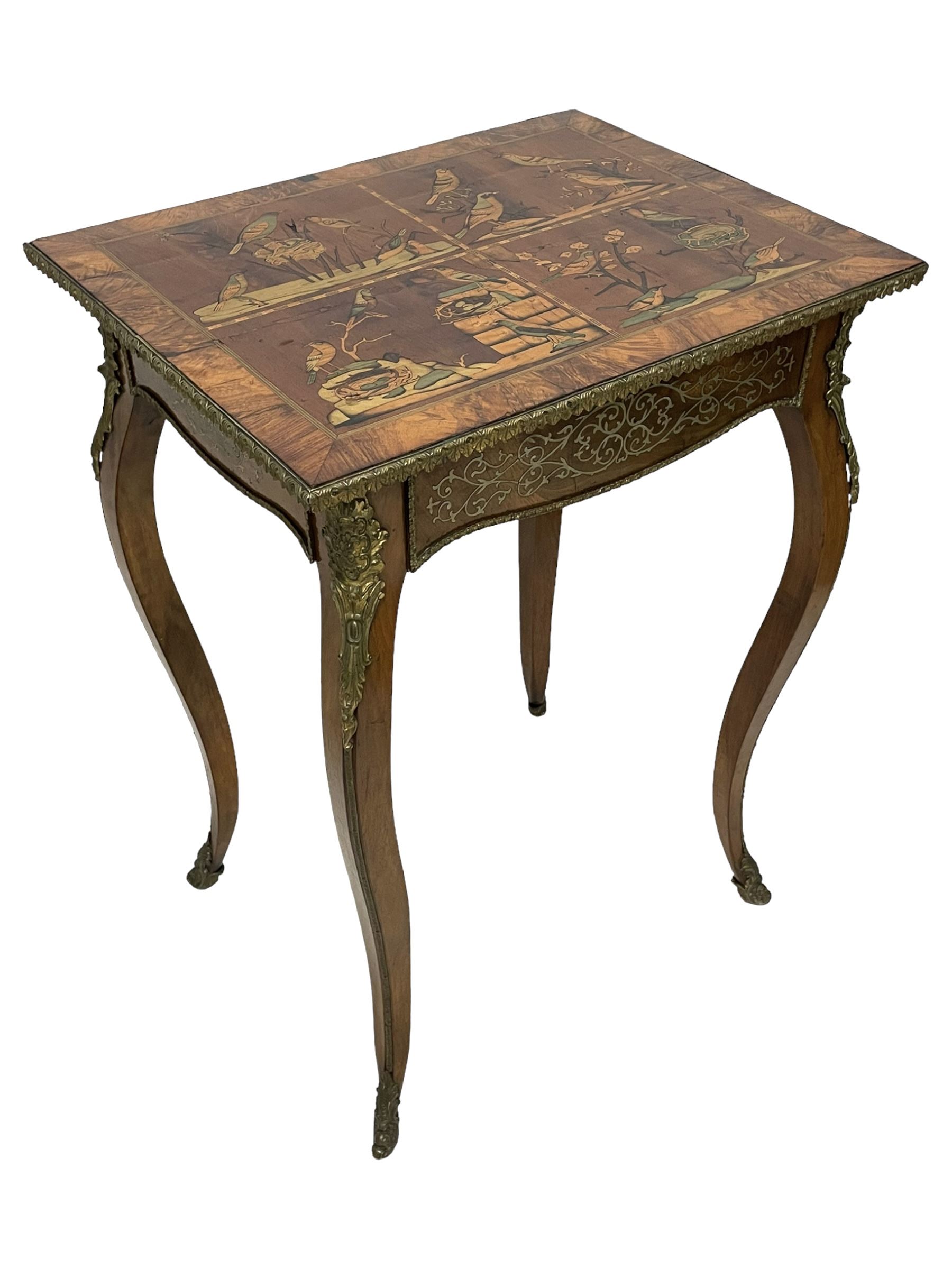 In the manner of Émile Gallé - late 19th to early 20th century inlaid walnut side table, rectangular top inlaid with Japonisme decoration depicting birds within trees, figured crossbanding and cast gilt foliate applied edge, single frieze drawer inlaid with scrolling brass work, on cabriole supports with ornate floral mounts