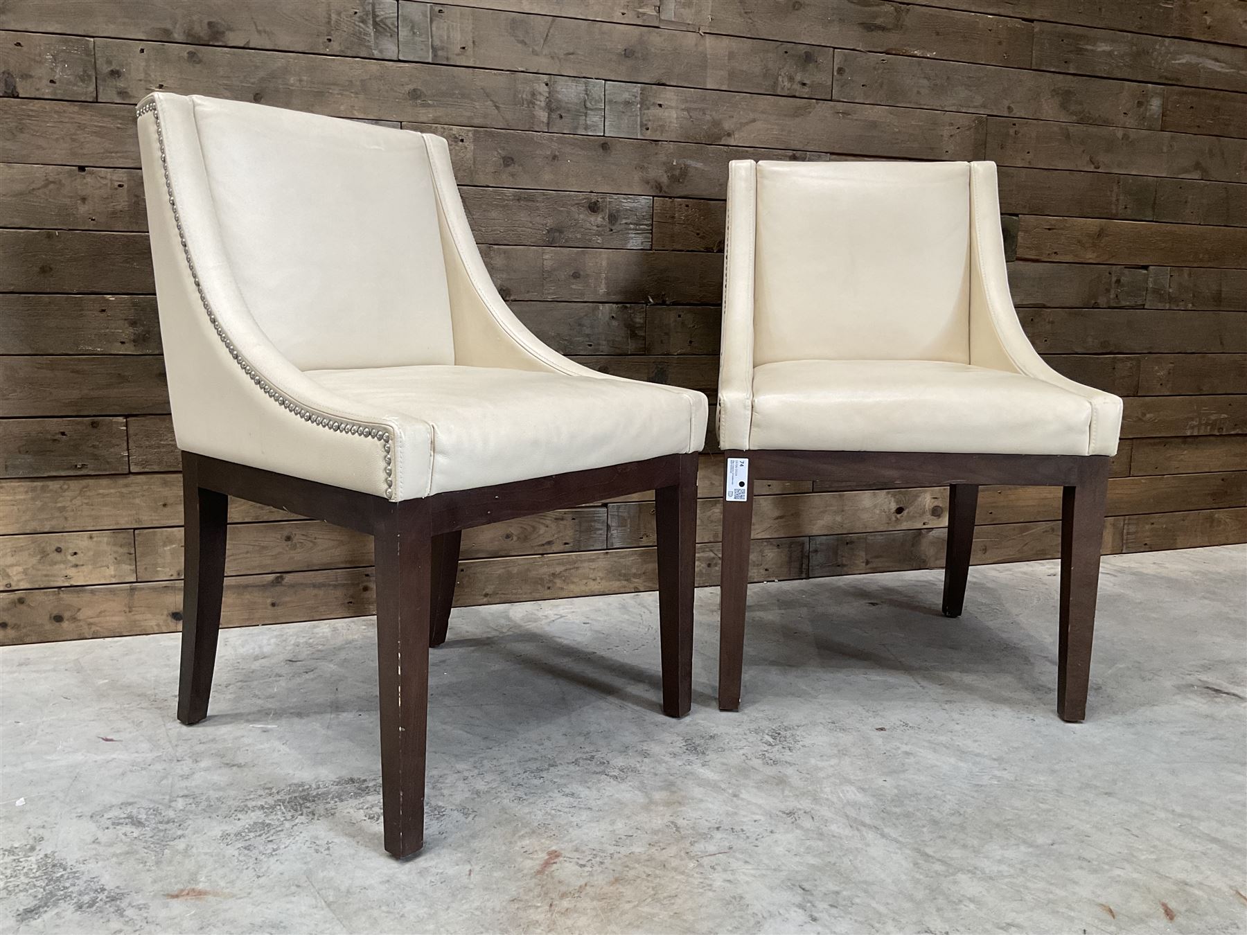 28 x walnut framed dining chairs, upholstered in beige leather