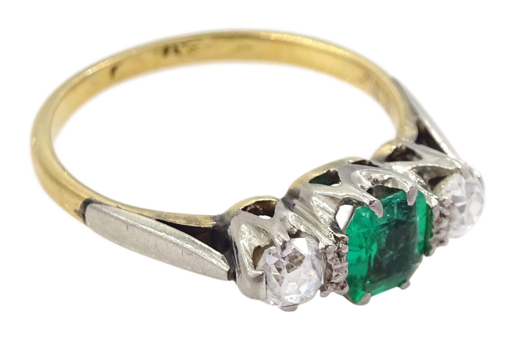 Early 20th century 15ct and palladium three stone emerald and old cut diamond ring, emerald approx 0.35 carat, total diamond weight approx 0.40 carat