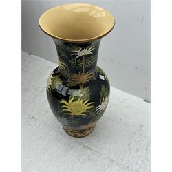 Floor vase with stylised flowers on a black ground, H84cm