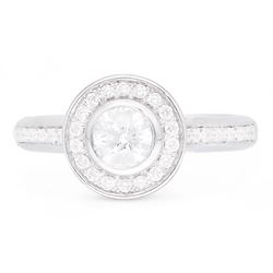 18ct white gold round brilliant cut diamond halo cluster ring, the principal diamond of approx 0.50 carat, with diamond surround and diamond set shoulders, hallmarked, total diamond weight approx 0.75 carat