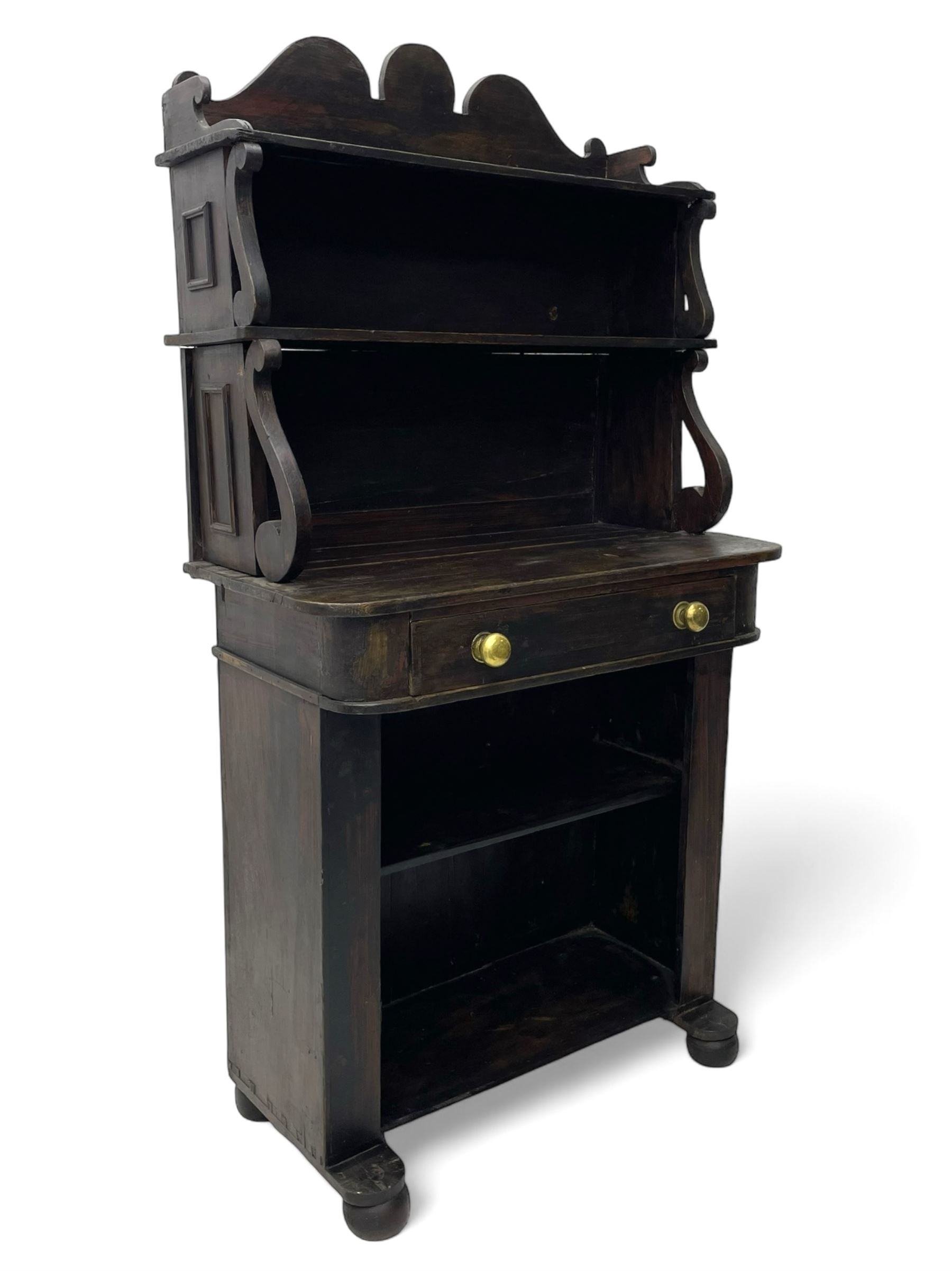 Victorian scumbled pine chiffonier, raised shaped back fitted with two shelves on S-scroll supports, rectangular top with rounded corners over single frieze drawer and open shelf, on projecting rounded sledge platforms and compressed bun feet, scumbled to resemble rosewood 