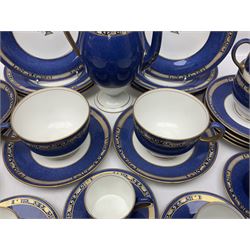 Wedgwood part tea and coffee service, comprising coffee pot, six coffee cans with five saucers, seven teacups with ten saucers and seven side plates, each decorated with floral bouquet to centre, in a gilt and speckled blue border, pattern x9933, with printed mark beneath