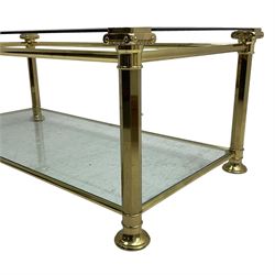 Gilt metal and bevelled glass two-tier coffee table, the faceted supports with Ionic Capitals