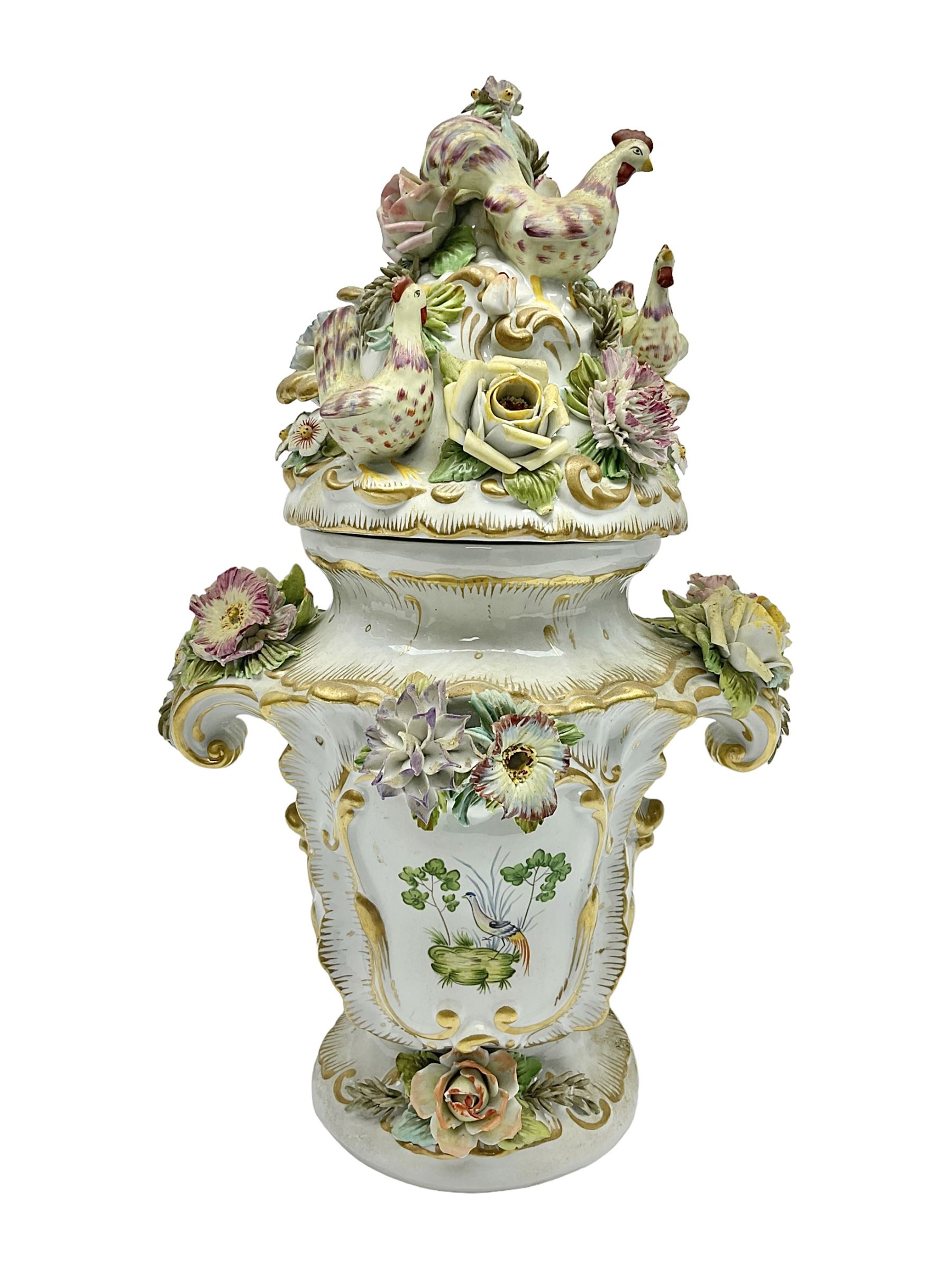 Continental vase and cover, with painted panels of birds in foliage, with applied flower decoration to the body and cover, H38cm 